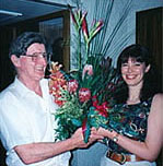 Julie Delbridge presents Neil O'Donnell with flowers